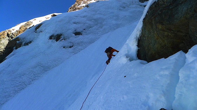 Paul leads the first of two pitches in the upper couloir on good ice.