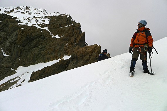 Stu looks back at the abseiled bluffs on the SW ridge